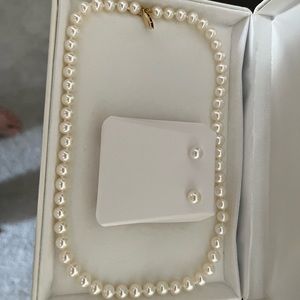 Wore to my wedding. Used one time. Matching pearl necklace and earrings.